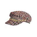Elegancki damski beret w kolorze, ozdobiony dekoracją